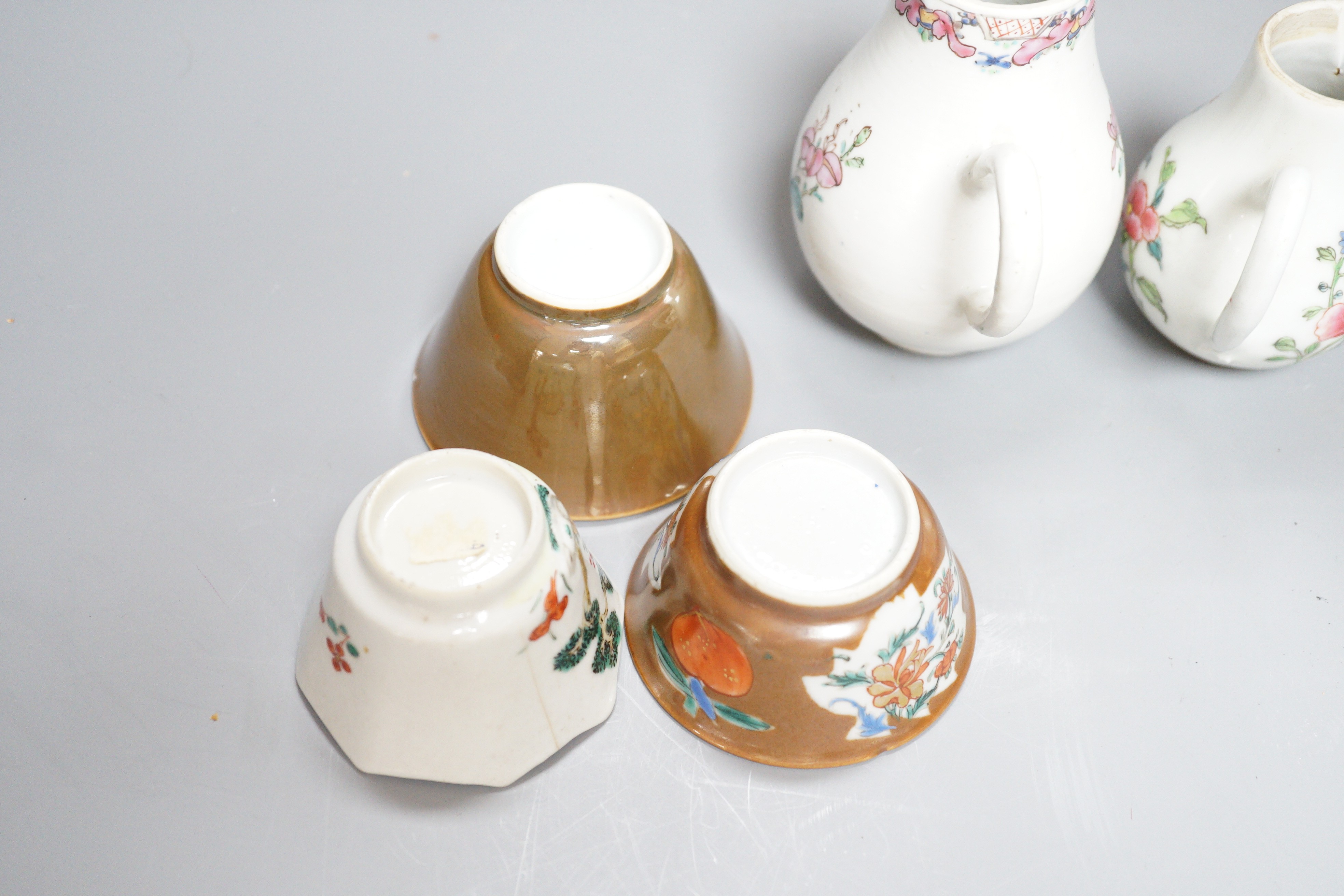 Three Chinese export famille rose cream jugs, one with pierced cover and three small bowls, 18th century and later